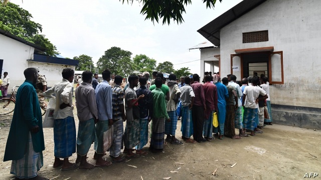 assam residents stand in line to check if their names are included on the final list of the national register of citizens photo afp