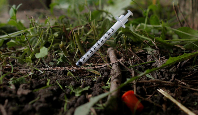 a used needle sits on the ground in a park in lawrence massachusetts us photo reuters a used needle sits on the ground in a park in lawrence massachusetts us photo reuters