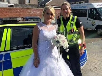 watch bride arrives to wedding in police car