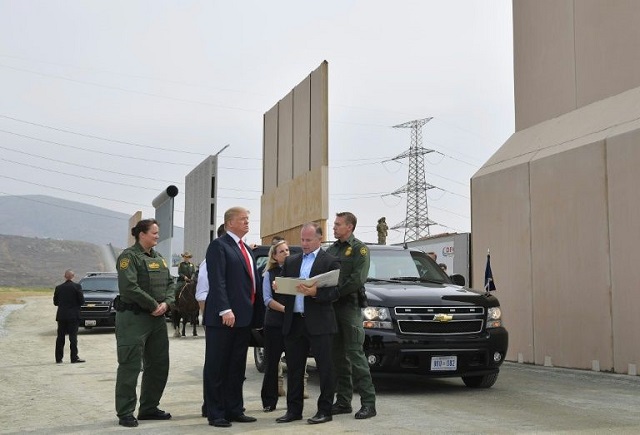 us president donald trump inspects border wall prototypes in san diego california on march 13 2018 photo afp