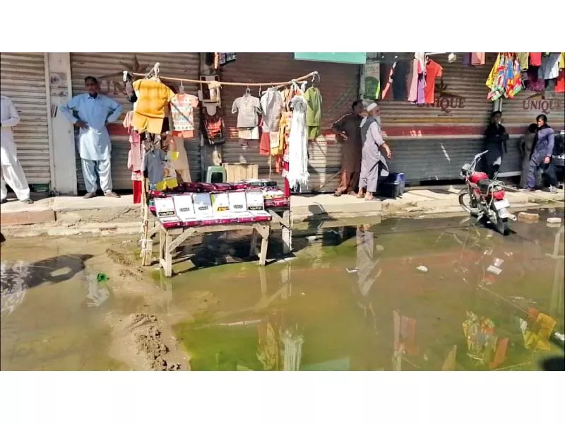 the sewage water is spreading an odour in the market photo express the sewage water is spreading an odour in the market photo express