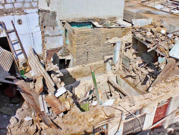 the two storey building in kharadar collapsed completely after its roof caved in photo online