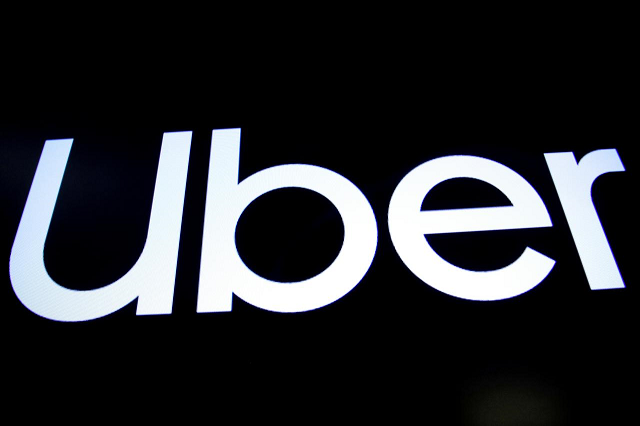 a screen displays the company logo for uber on the day of its ipo at the new york stock exchange in new york us may 10 2019 photo reuters
