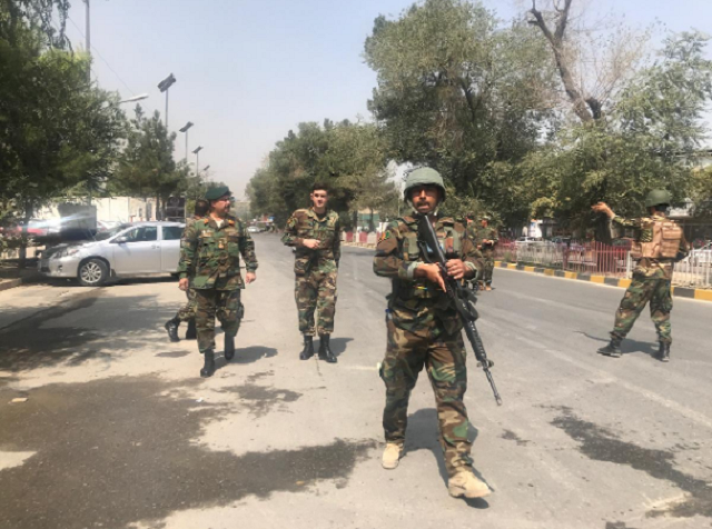 security forces are seen near the site where suicide bomber blew himself up in the centre of kabul photo reuters