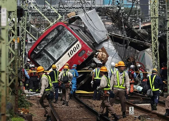 the accident derailed the front carriage of the train and badly damaged the truck photo afp the accident derailed the front carriage of the train and badly damaged the truck photo afp