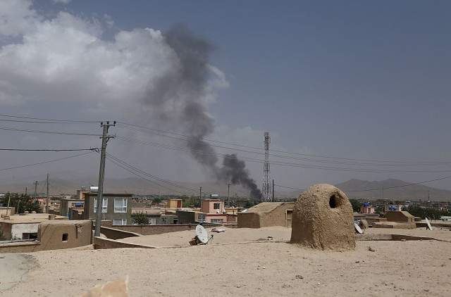 smoke rises after a taliban attack on the afghan provincial capital of ghazni on aug 10 2018 photo afp