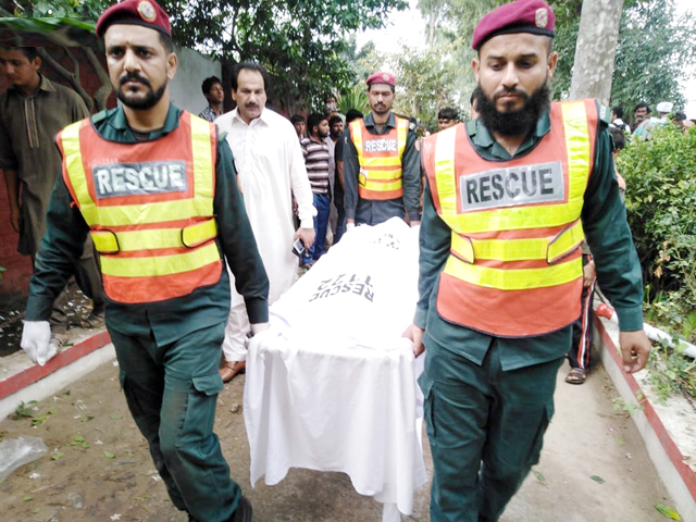rescue officials shift body of a victim to a hospital in narowal on friday photo nni