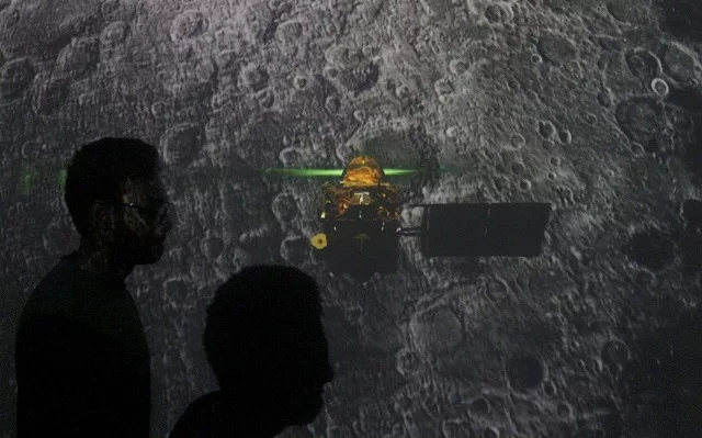student walk past a screen during a live streaming of chandrayaan 2 landing at an educational institute in mumbai india september 7 2019 photo reuters student walk past a screen during a live streaming of chandrayaan 2 landing at an educational institute in mumbai india september 7 2019 photo reuters