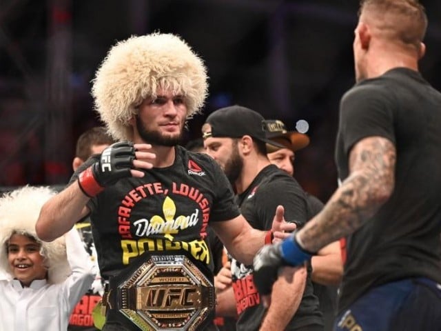 The Dagestan native escaped a guillotine choke to take Poirierâs back before shifting his position and sinking into a rear naked choke. PHOTO: REUTERS