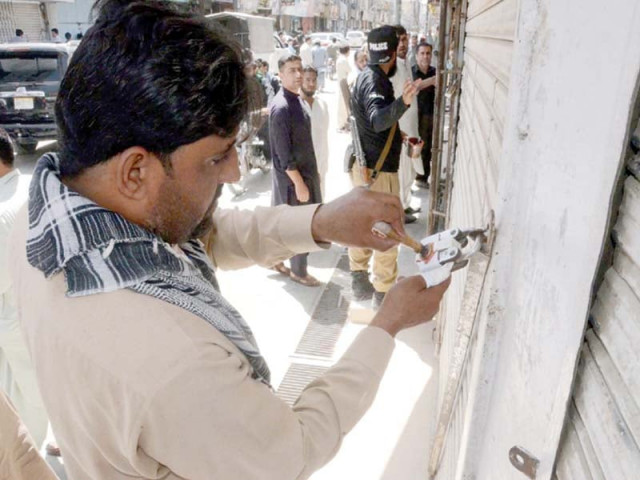 security officials seal shops along the route to be taken by the ashura procession in quetta photo ppi security officials seal shops along the route to be taken by the ashura procession in quetta photo ppi