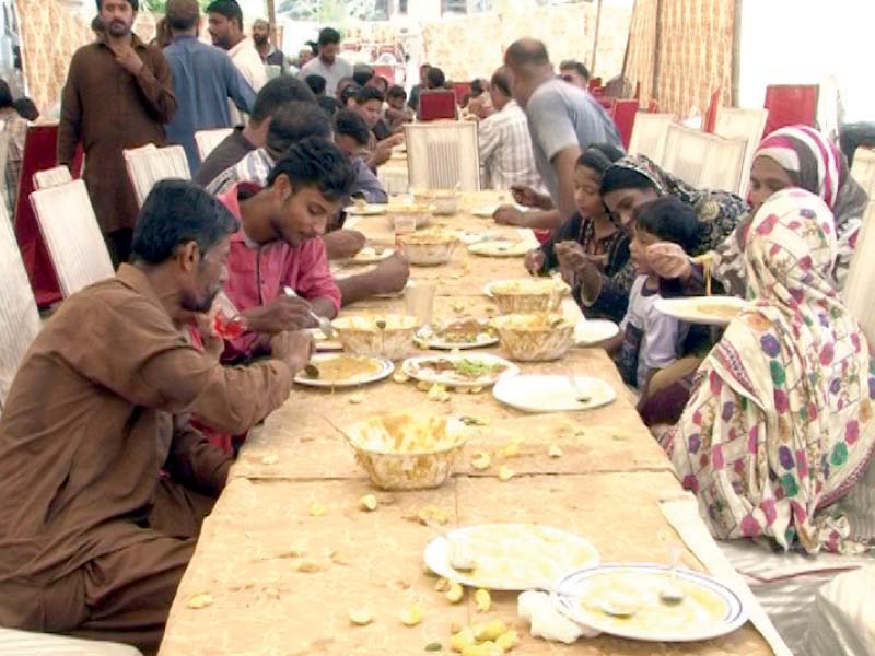 spreads of food and drink and stalls serving niaz are set up along the procession routes in karachi every year during muharram cauldrons of haleem are prepared on the roads in different parts of the city and served to the public photos express