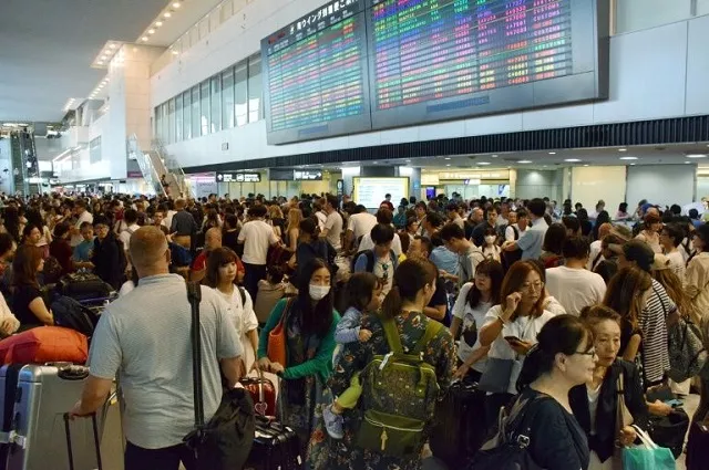 passengers wait at the arrivals hall of narita international airport for transportation as trains running to and from the airport were halted due to passing typhoon faxai in narita chiba prefecture on sepr 9 2019 photo afp passengers wait at the arrivals hall of narita international airport for transportation as trains running to and from the airport were halted due to passing typhoon faxai in narita chiba prefecture on sepr 9 2019 photo afp