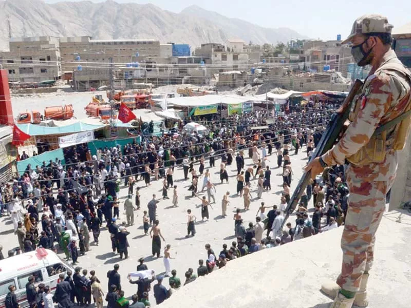 security official stands alert during the ashura procession in quetta photo ppi security official stands alert during the ashura procession in quetta photo ppi