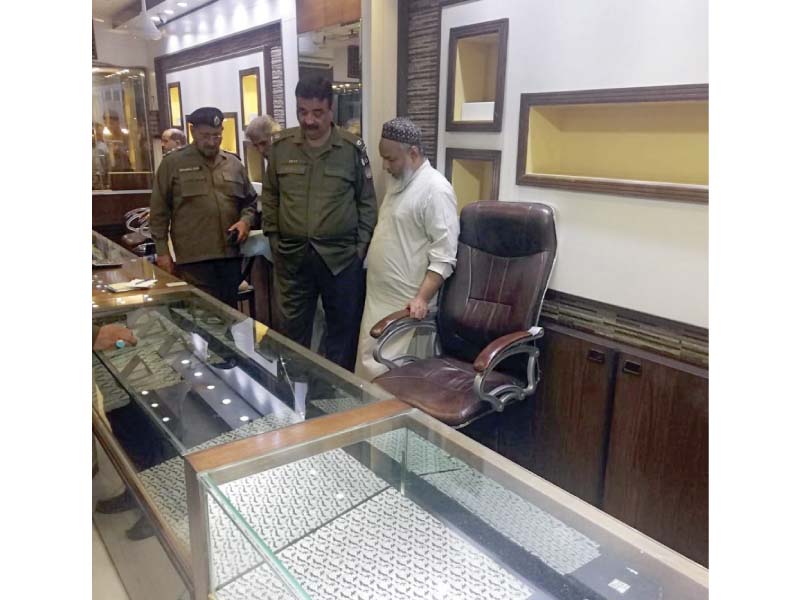 police inspect the jewellery shop where robbers struck during the long weekend on ashura photo express
