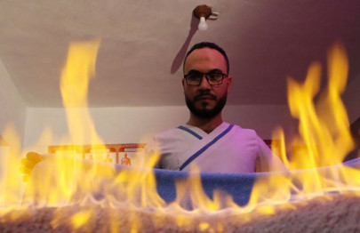 egyptian masseur plays with fire to ease muscle pain