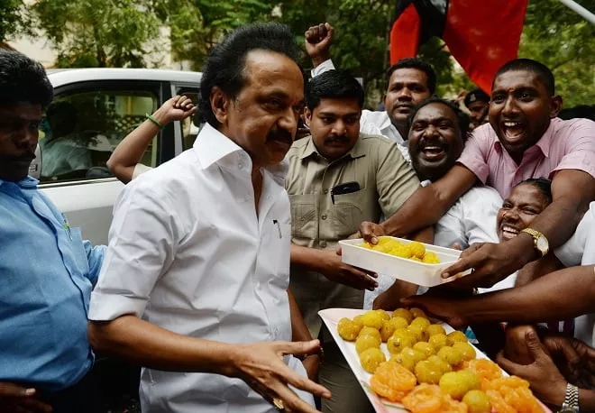 indian dmk party working president mk stalin distributes sweets to party supporters photo afp file indian dmk party working president mk stalin distributes sweets to party supporters photo afp file