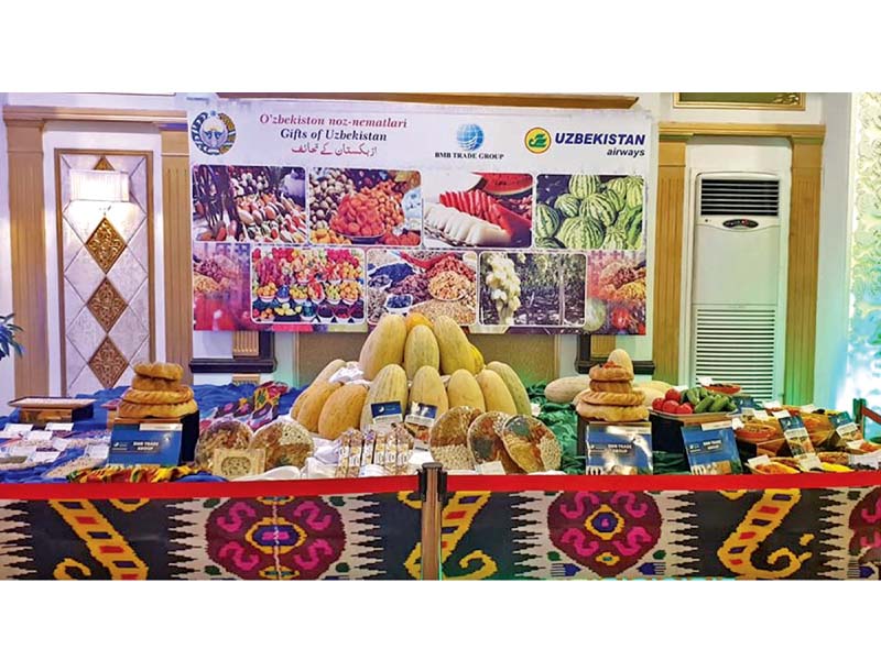 a view of a kiosk displaying fruits from uzbekistan at an event to celebrate uzbekistan s national day photo dna