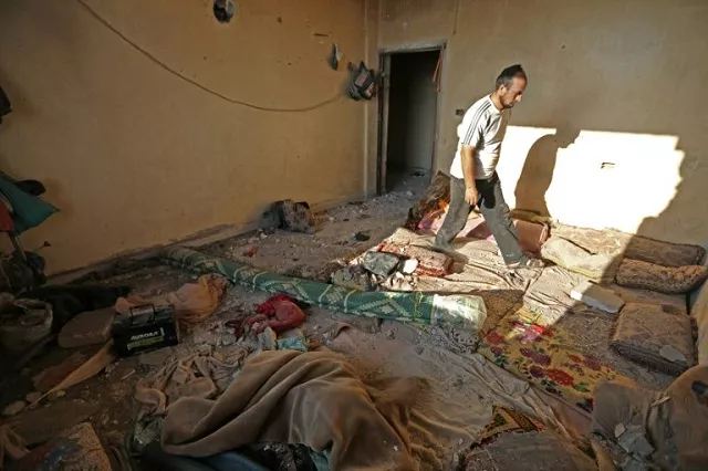 a reported russian air strike on wednesday hit a building that was hosting displaced syrians in the village of al daher photo afp a reported russian air strike on wednesday hit a building that was hosting displaced syrians in the village of al daher photo afp