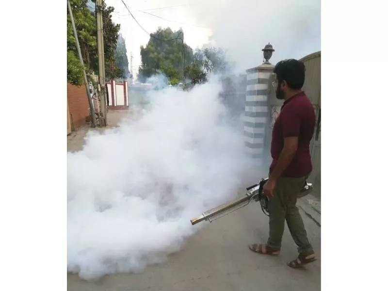 a technician busy in anti dengue fumigation in a rawalpindi neighbourhood on saturday photo express a technician busy in anti dengue fumigation in a rawalpindi neighbourhood on saturday photo express