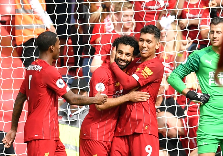 liverpool did what city could not in recovering from conceding early to ease past newcastle 3 1 and maintain their 100 percent start to the season photo afp