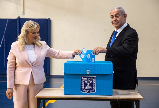 israeli prime minister benjamin netanyahu and his wife sara casts their votes at a voting station in jerusalem photo afp