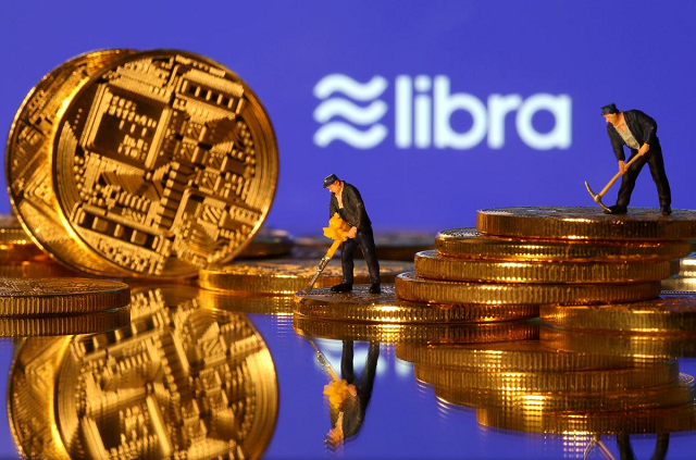 small toy figures are seen on representations of virtual currency in front of the libra logo in this illustration picture june 21 2019 photo reuters