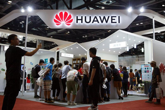 people look at products at the huawei stall at the international consumer electronics expo in beijing china august 2 2019 photo reuters