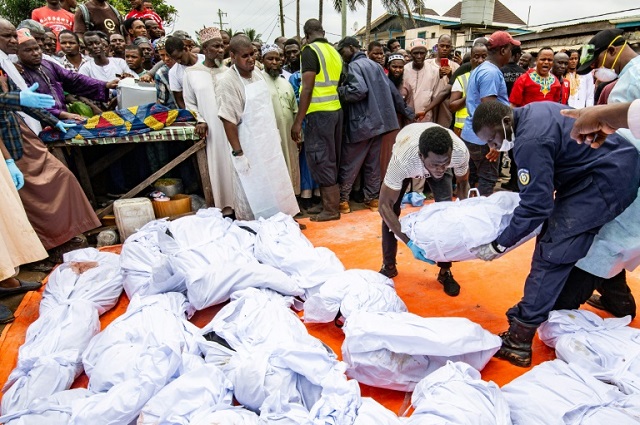 in this photo the victims 039 bodies are being prepared for burial photo afp