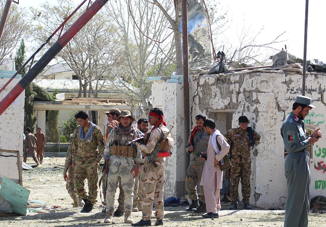 afghan security forces stand at the site of a car bomb attack in qalat capital of zabul province afghanistan september 19 2019 photo reuters