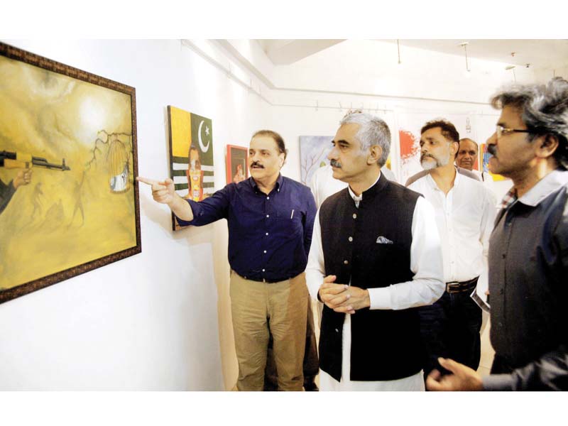 punjab minister for information and culture mian muhammad aslam iqbal views paintings made by young artists for a competition organised by the lahore arts council photo online