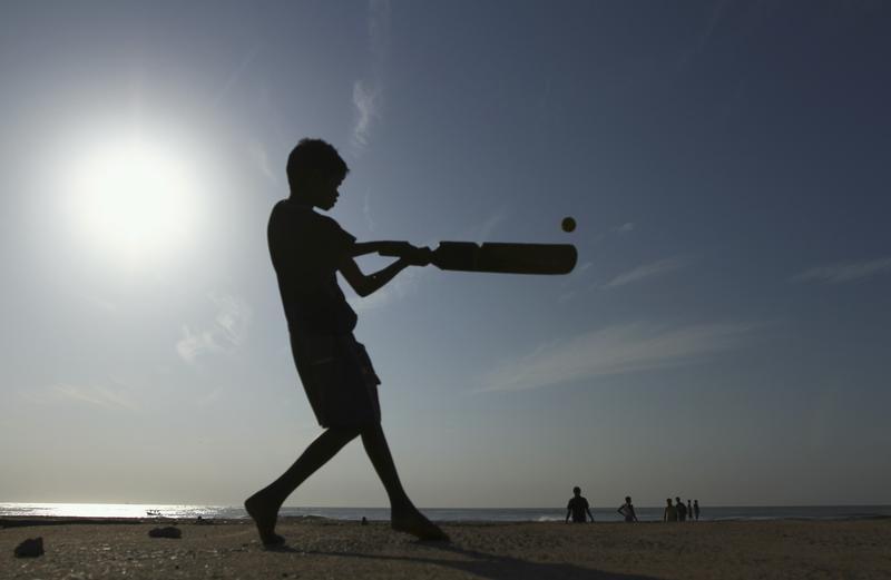 a boy plays cricket photo reuters
