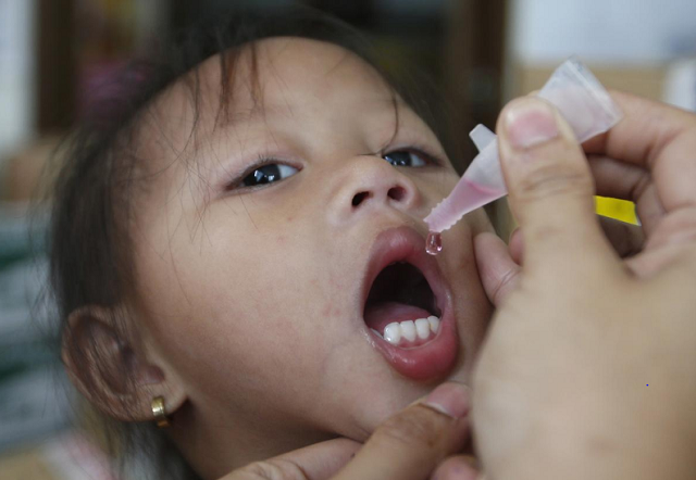 a girl receives anti measles vaccination drops at a health centre in baseco compound in tondo photo reuters a girl receives anti measles vaccination drops at a health centre in baseco compound in tondo photo reuters
