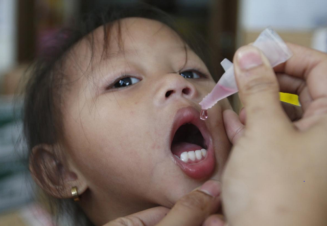 a girl receives anti measles vaccination drops at a health centre in baseco compound in tondo photo reuters