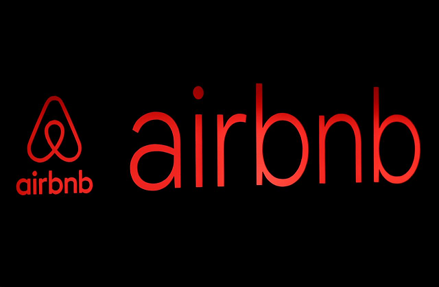 the logos of airbnb are displayed at an airbnb event in tokyo japan june 14 2018 photo reuters