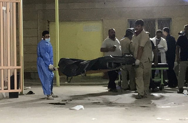 hospital workers use a stretcher to carry the body of a victim who was killed in a bus bombing in karbala iraq photo reuters hospital workers use a stretcher to carry the body of a victim who was killed in a bus bombing in karbala iraq photo reuters