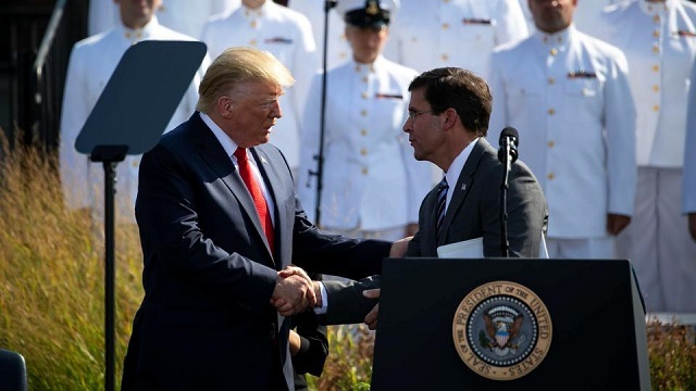 us president donald trump shakes hands with us defense secretary mark esper during a ceremony marking the 18th anniversary of september 11 attacks at the pentagon in arlington virginia us september 11 2019 file photo reuters