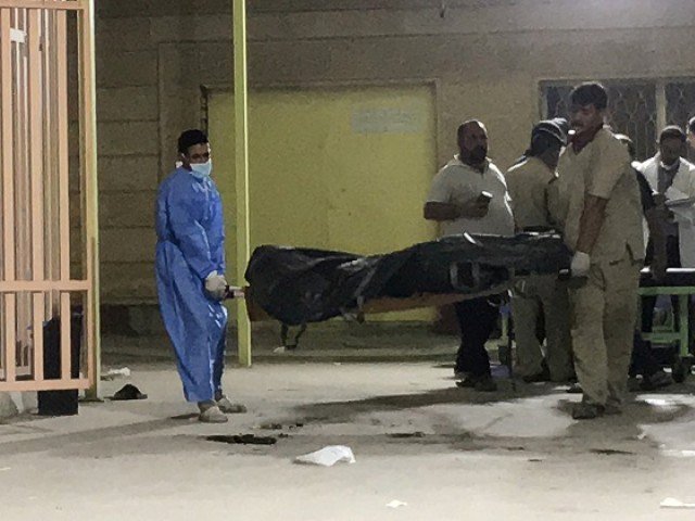 hospital workers use a stretcher to carry the body of a victim who was killed in a bus bombing in karbala iraq photo reuters