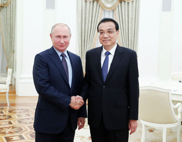 russian president vladimir putin with chinese premier li keqiang at the kremlin in moscow photo xinhua russian president vladimir putin with chinese premier li keqiang at the kremlin in moscow photo xinhua
