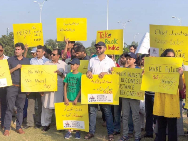 people protest against high private school fees photo express people protest against high private school fees photo express