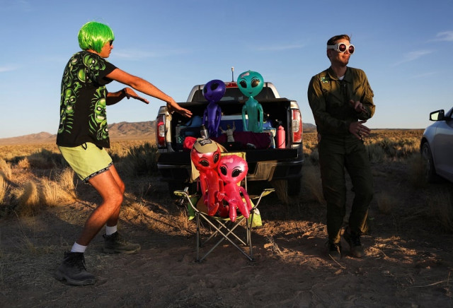 two men dance on a road to an entrance to area 51 photo reuters two men dance on a road to an entrance to area 51 photo reuters