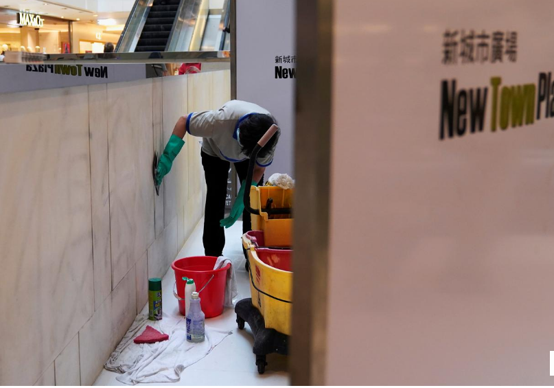 workers clean graffiti at new town plaza in sha tin hong kong china photo reuters