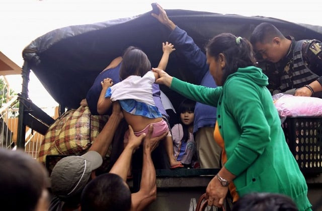 residents are assisted into a truck after the local government implemented preemptive evacuations at barangay matnog daraga albay province on december 25 2016 due to approaching typhoon nock ten photo afp residents are assisted into a truck after the local government implemented preemptive evacuations at barangay matnog daraga albay province on december 25 2016 due to approaching typhoon nock ten photo afp