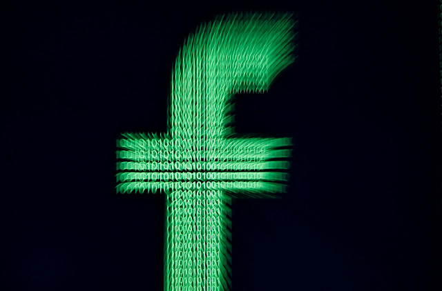 a 3d printed facebook logo is displayed in front of binary digits in this illustration taken march 18 2018 photo reuters