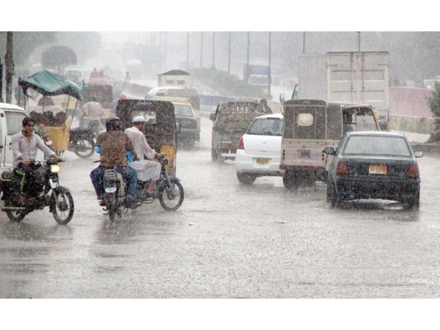 commuters make their way through traffic during rain on tuesday photo online