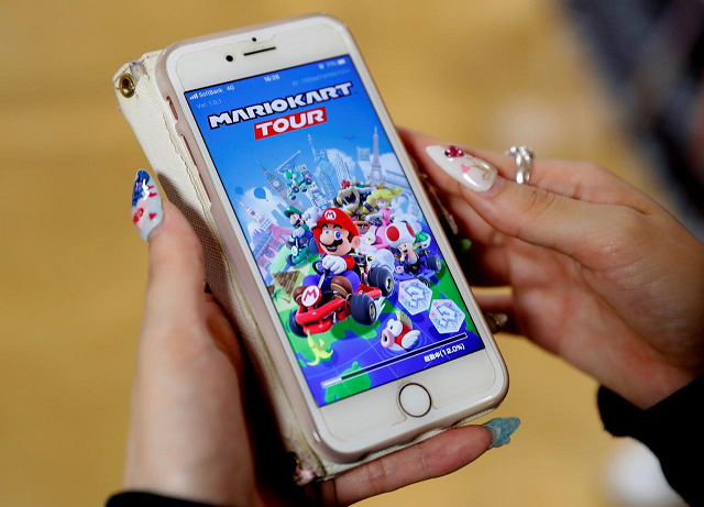 a woman shows the mobile title mario kart tour on her smartphone during an interview with reuters at tatio 039 s game center in tokyo japan september 25 2019 photo reuters a woman shows the mobile title mario kart tour on her smartphone during an interview with reuters at tatio 039 s game center in tokyo japan september 25 2019 photo reuters