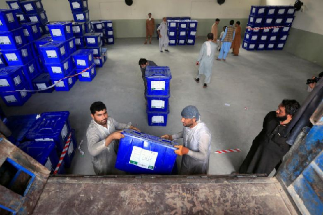 afghan election commission workers load ballot boxes and election material to be transported to the polling stations in jalalabad photo reuters