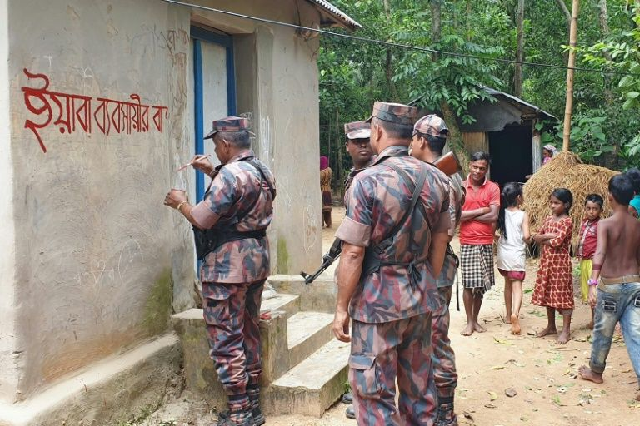 bangladesh border guards have bee painting signs of suspected drug and human traffickers in an effort to publicly shame them this sign read quot house of yaba trafficker quot photo afp