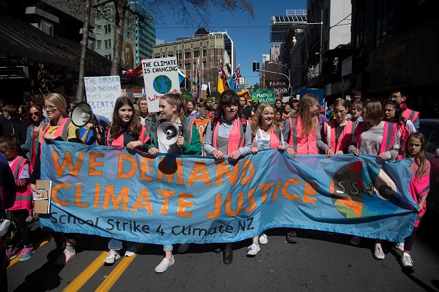 protesters march to parliament down lampton quay during a climate strike protest march in wellington photo afp