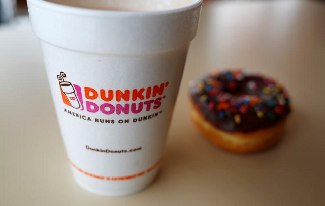 a dunkin 039 donuts coffee and donut are seen lying on a table photo reuters