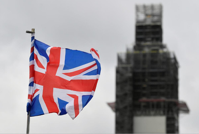 a union jack flag flutters as big ben clock tower is seen behind at the houses of parliament in london photo reuters a union jack flag flutters as big ben clock tower is seen behind at the houses of parliament in london photo reuters